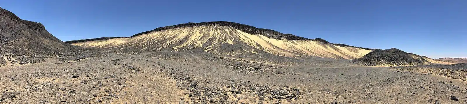 Dark volcanic rock in Egypt Black Desert
