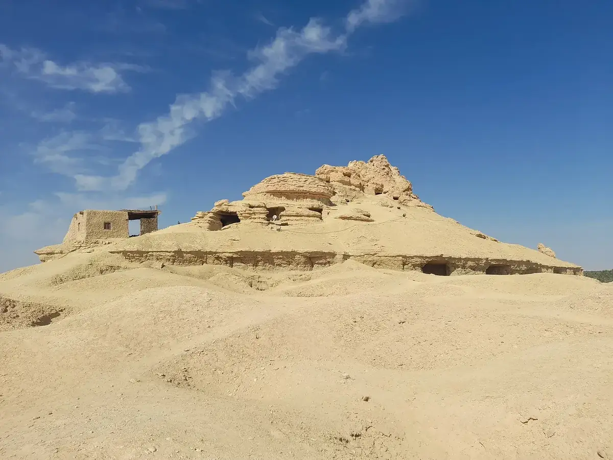 Exterior of Gebel al-Mawta with ancient tomb openings in Siwa Oasis