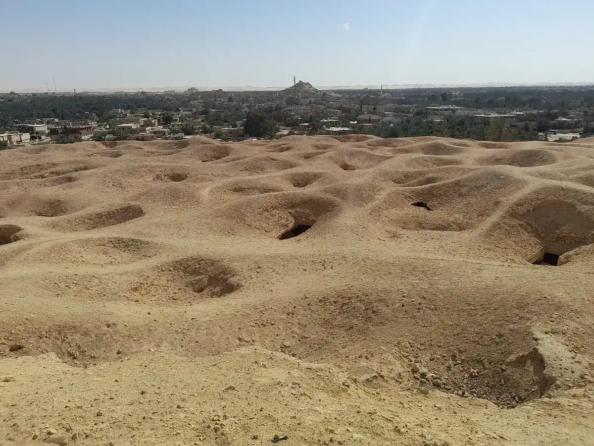 Panoramic view of rock-cut tombs across Gebel al-Mawta in Siwa Oasis