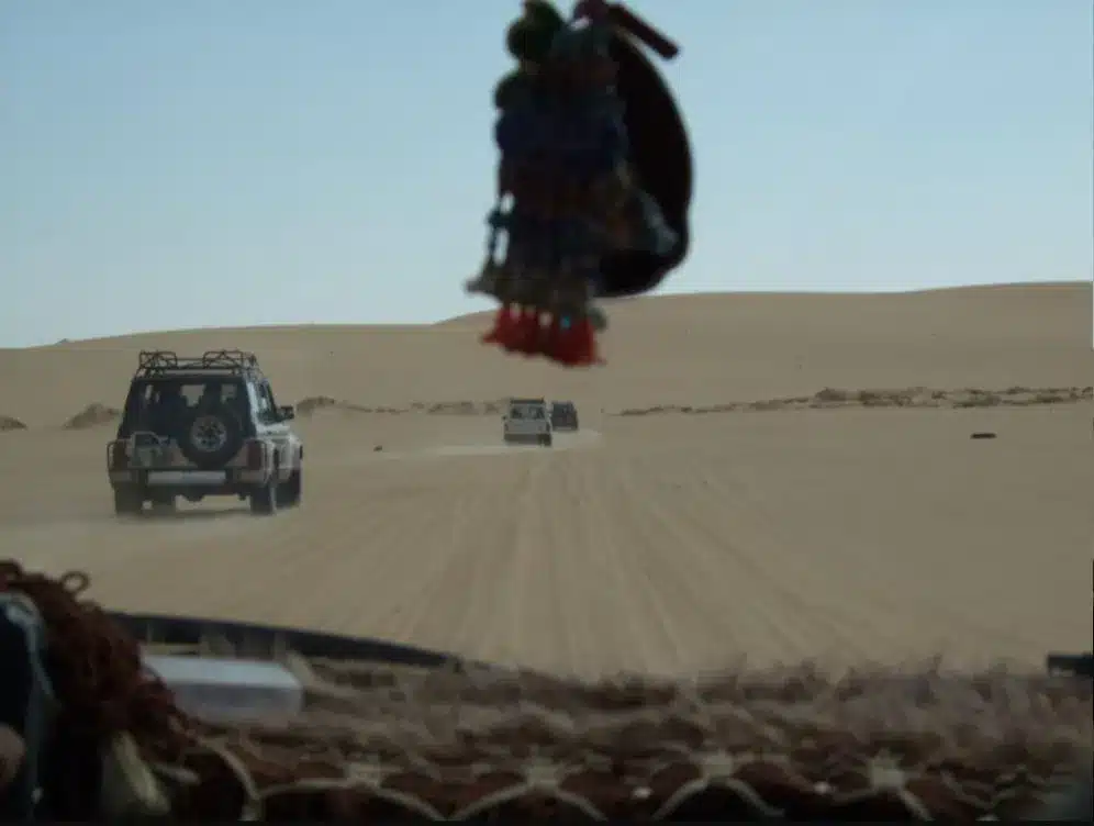 4x4 vehicles driving through the Siwa desert during a safari