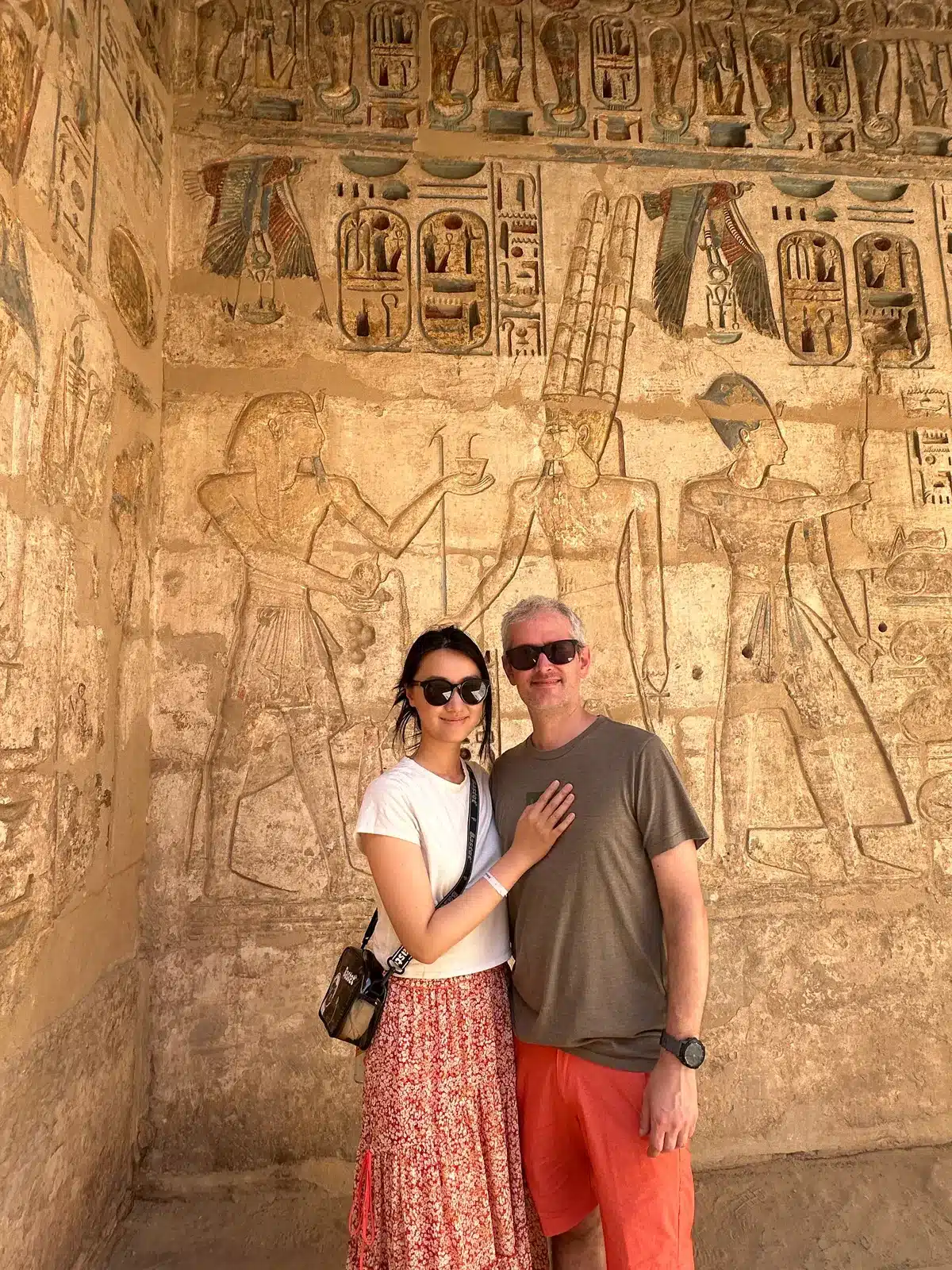 Couple visiting an ancient decorated tomb on a private Luxor tour