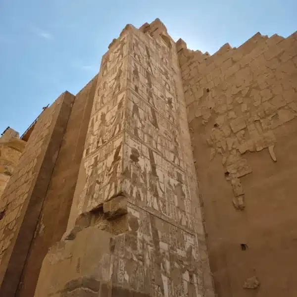Carved sandstone walls and columns at Karnak Temple in Luxor