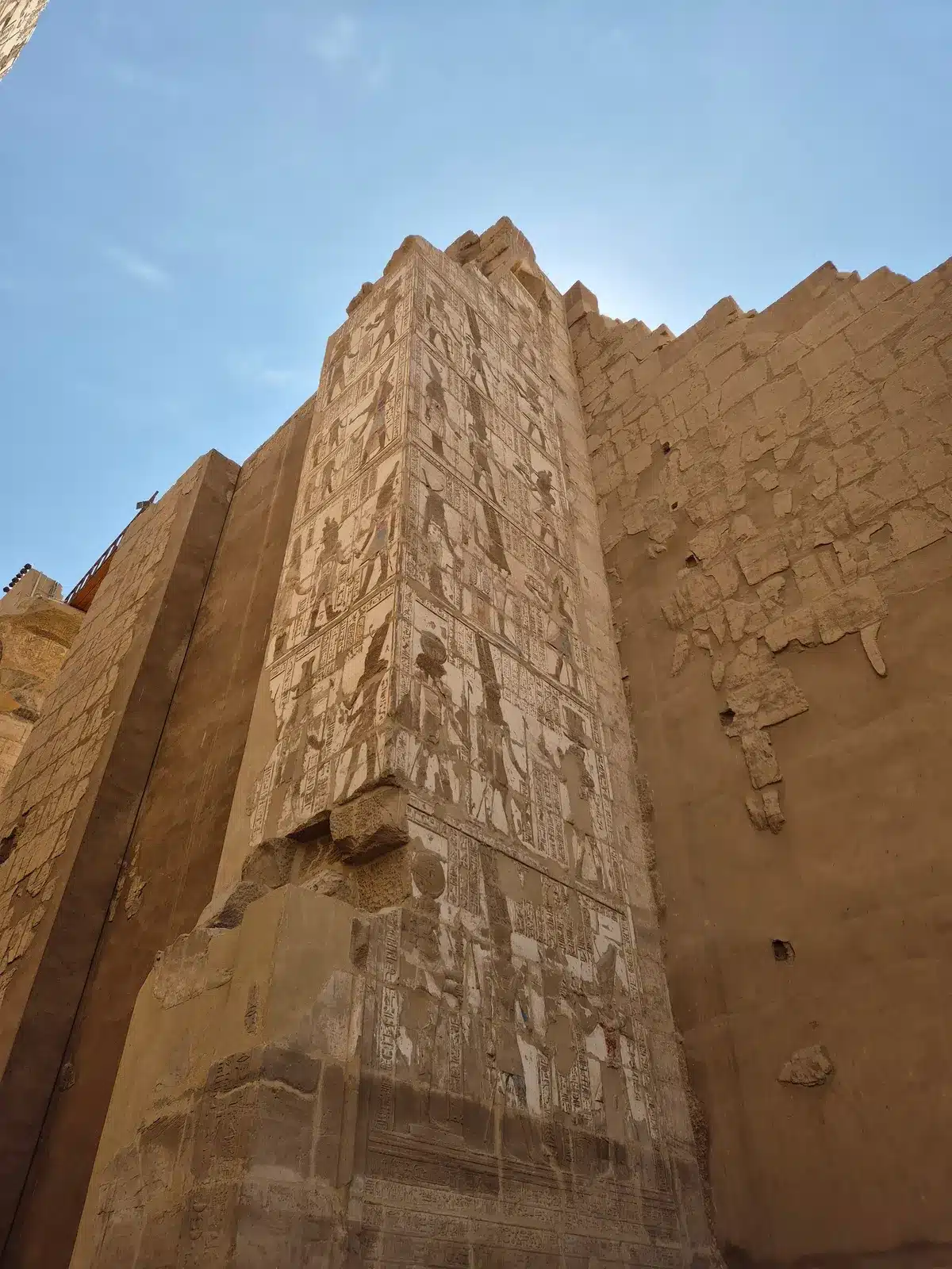 Carved sandstone walls and columns at Karnak Temple in Luxor