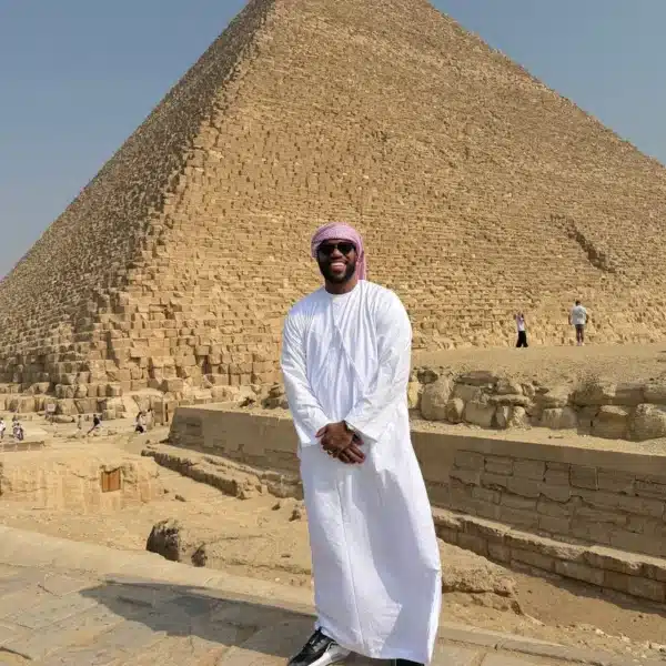 Traveler standing in front of the Great Pyramid of Giza