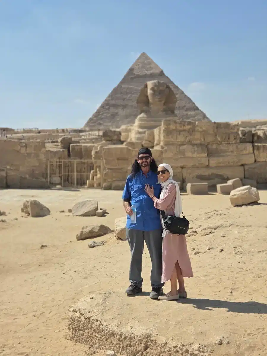 Couple beside the Great Sphinx during a private Giza visit