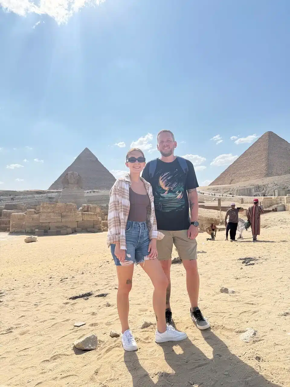 Christmas Sightseeing at the Giza Pyramids Travelers visiting the Giza Pyramids and Sphinx during a Cairo short break