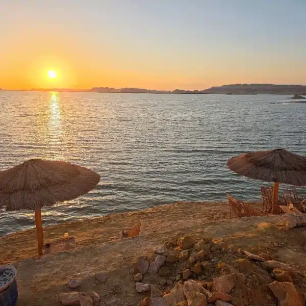 Golden sunset over the water at Fatnas Island in Siwa Oasis
