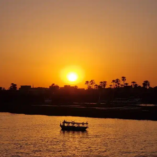 Golden sunset over the Nile River viewed during a cruise