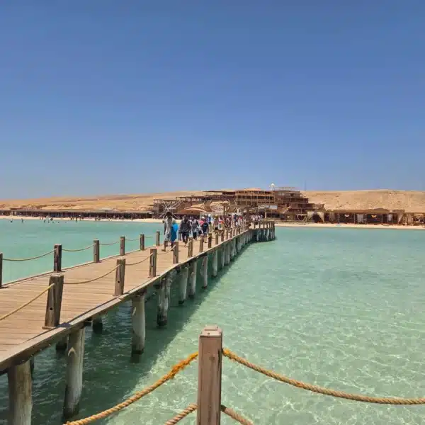 Wooden jetty extending across turquoise water at Orange Bay near Hurghada
